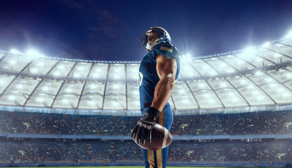 Wall Mural - American football player in professional sport arena.