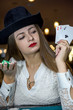 © RomanR - Young lady in casino with four aces
