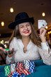 © RomanR - Young lady in casino with four aces