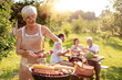 © ivanko80 - Senior woman cooking meat for family