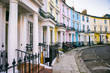 Scenic London, England view with pastel colored buildings on an empty curved street