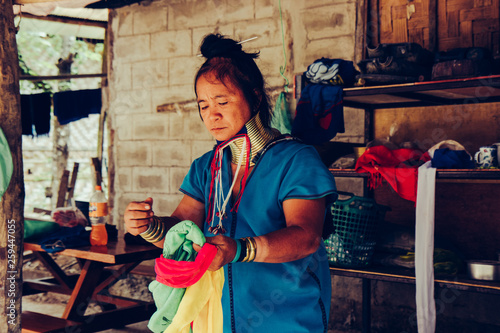 Plakat Long Neck Woman wearing at traditional costume. Tribal village Thailand.