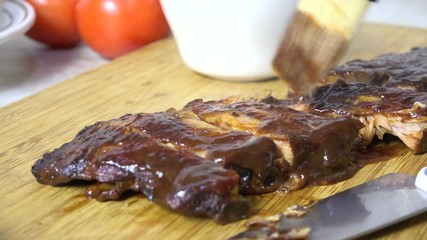 Sticker - Brushing barbecue sauce on sliced ribs