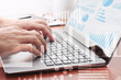 © tadamichi - Business intelligence concept. Businessman using laptop for analysis. Laptop and many graphs.