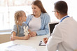 © Pixel-Shot - Little girl with mother at pediatrician's office