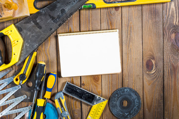 Wall Mural - Working tools on wooden rustic background.