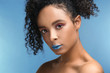 © Pixel-Shot - Portrait of beautiful African-American woman with unusual makeup on color background