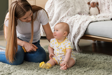 Sticker - Happy mother with adorable baby girl at home