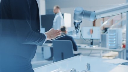 Aufkleber - Stylish Female Industrial Robotics Engineer Uses Tablet Computer with CAD Software and to Manipulate and Program Robot Arm for Lifting Moving Objects. Technology Research Facility for Machine Learning