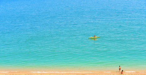  seascape and natural landscape view people on the beach with turquoise water in Sirolo Conero, Marche Italy