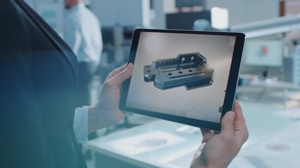 Aufkleber - Stylish Female Industrial Robotics Engineer Uses Tablet Computer with CAD Software and to Manipulate and Program Robot Arm for Lifting Moving Objects. Technology Research Facility for Machine Learning