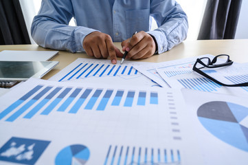 business documents on office  graph financial with social network diagram discussing data analysis data the charts and graphs