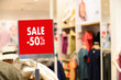 © onephoto - Department store with sale discount sign in shop  Sale sign Sale concept