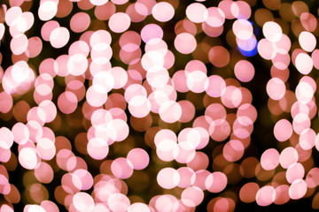 Wall Mural - Blurred and bokeh pink led lighting in full screen and black background.