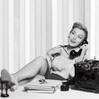 © BillionPhotos.com - Attractive young woman speaking on vintage phone