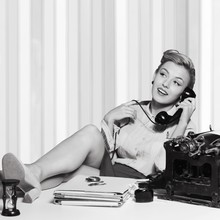 Attractive Young Woman Speaking On Vintage Phone