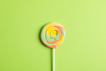 Sweet candy with space for text on color background, top view