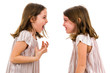 © _jure - Identical twin girls are looking at each other and smiling.
