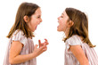 © _jure - Identical twin girls sisters are arguing yelling at each other.