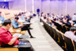 © Koonsiri - Blurry of auditorium for shareholders' meeting or seminar event