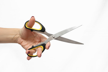 Hand is holding scissors isolated on a white background