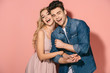 © LIGHTFIELD STUDIOS - smiling girlfriend in pink dress and handsome boyfriend in denim shirt hugging