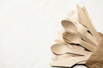 Disposable tableware from natural materials, wooden spoon, fork, knife, eco-friendly. Place for text