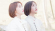 © atiger - Beautiful young brunette woman in white shirt posing with herself in mirror like twins.Outdoor fashion portrait of glamour Chinese cheerful stylish girl, emotions, people, beauty and lifestyle concept
