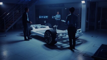 Leinwandbilder - Automobile Engineers Working on Electric Car Platform Chassis Prototype, Using Tablet with CAD Software for 3D Concept. In Automotive Innovation Facility Vehicle Frame with Wheels, Engine and Battery