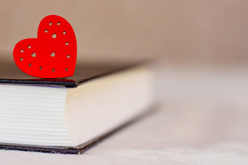 Wall Mural - Red heart on a thick book, the Bible. I love the Bible. Copy space