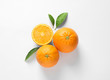 © New Africa - Juicy oranges and leaves on white background, top view