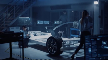 Fototapete - Automotive Design Engineers Work and Do Tests on Electric Car Chassis Prototype. In Innovation Laboratory Facility Concept Vehicle Frame Includes Wheels, Suspension, Engine and Battery.