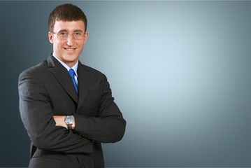 Canvas Print - Portrait of happy businessman on background