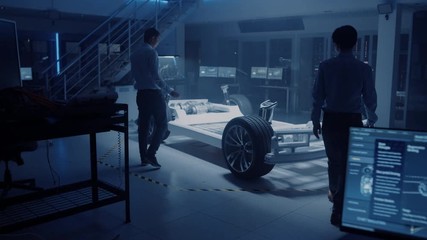 Leinwandbilder - Diverse Team of Automobile Design Engineers Enter Automotive Innovation Facility Start Working on Electric Car Platform Chassis Prototype that Includes Wheels, Suspension, Hybrid Engine and Battery