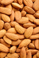 Sticker - almonds top view texture, for background, vertical, wallpaper