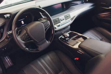 Canvas Print - car interior. Modern car speedometer and illuminated dashboard. Luxurious car instrument cluster. Close up shot of car instrument panel.