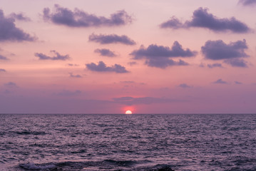 Wall Mural - Pink and purple sunset over the ocean