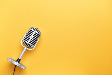 retro microphone on color background