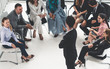 © InfiniteFlow - Businesswomen and businessmen attending group meeting conference in office room. Corporate business team concept.