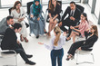 © InfiniteFlow - Businesswomen and businessmen attending group meeting conference in office room. Corporate business team concept.