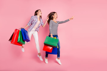 Sticker - Attention bargains. Profile side full length body size photo of cheerful students stylish consumers have purchases recommend choose advise suggest wear checked shirts jeans isolated pink background 