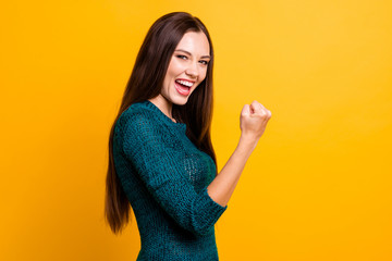 Sticker - Close up side profile photo beautiful her she lady eyes closed open toothy mouth arms fists raised up air brown eyes ecstatic wear green knitted pullover jumper clothes isolated yellow background