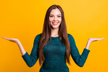 Sticker - Close up photo beautiful her she toothy lady both arms hands open palm empty space advising buy buyer pay payment customer prices wear green knitted pullover jumper isolated yellow background