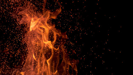 MACRO, DOF: Cinematic shot of flames flickering in the darkness of the night.