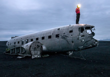 Wreckage of crashed airplane Dakota United States Navy Douglas Super DC-3 on the coast of iceland black sand beach. Solheimasandur, Iceland