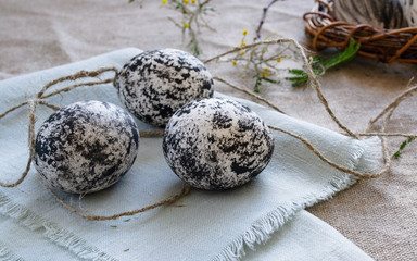 Scandinavian style Easter eggs on natural fabric. Close-up