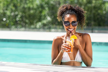 Fashion Beauty Woman In Pool Drinking Cocktail