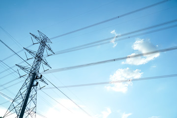 High voltage post. High voltage tower sky background.