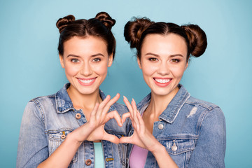 Wall Mural - Close up photo of funny funky satisfied ladies teenagers showing their fellowship love dressed in childish denim shirts isolated on blue background 