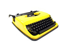 Retro Yellow Typewriter On A White Background